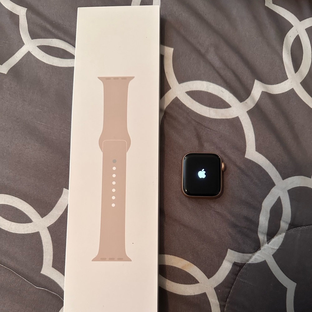 Used but like new. Includes rose gold watch, new band, and a charger.
